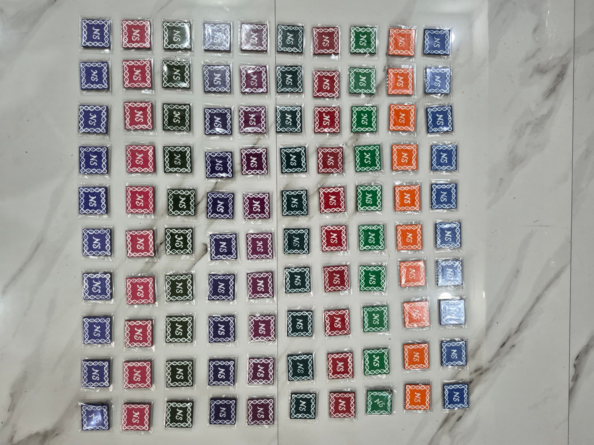 100 Kolam Magnets with Groom & Bride Initials "NS" — Marriage Return Gift — Bulk Order | Kolam with Meenal bulk order